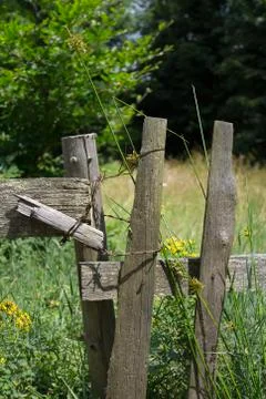 Old aged rustic and rural fence made of wood Stock Photos