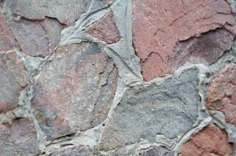 Old aged stone wall connected by mortar 스톡 사진