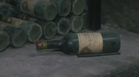 Old Aged Wine Bottles Storage in Dark Rustic Cellar Basement, Stack of Lying Dir Stock Footage 56800530