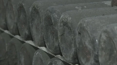 Old Aged Wine Bottles Storage in Dark Rustic Cellar Basement, Stack of Lying Dir Stock Footage 56800532