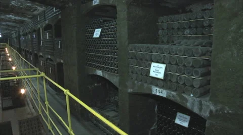 Old Aged Wine Bottles Storage in Dark Rustic Cellar Basement, Stack of Lying Dir Stock Footage 56800533