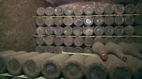 Old Aged Wine Bottles Storage in Dark Rustic Cellar Basement, Stack of Lying Dir Stock Footage 58484287