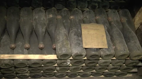 Old Aged Wine Bottles Storage in Dark Rustic Cellar Basement, Stack of Lying Dir Stock Footage 58485436