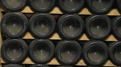 Old Aged Wine Bottles Storage in Dark Rustic Cellar Basement, Stack of Lying Dir Stock Footage 58486373