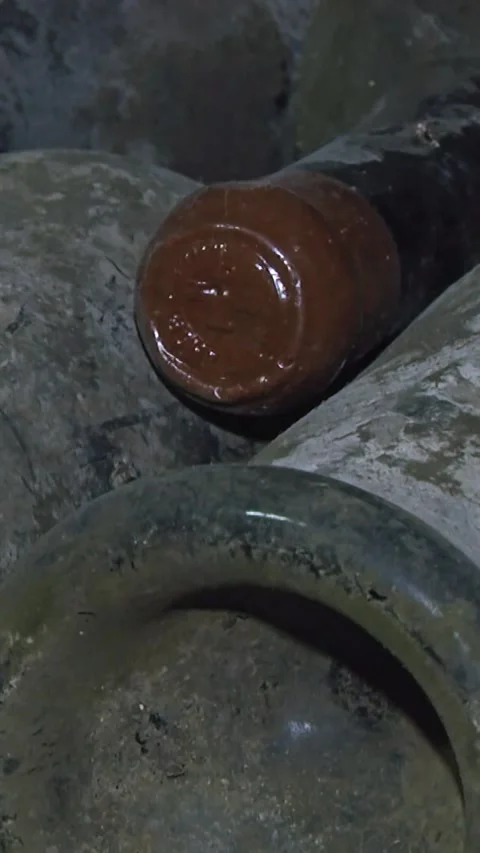 Old Aged Wine Bottles Storage in Dark Rustic Cellar Basement, Stack of Lying Dir 스톡 동영상 248878064