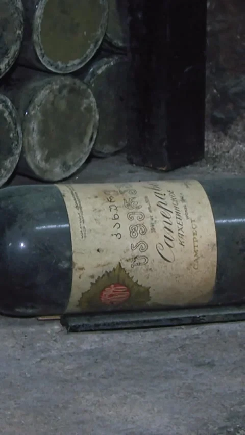 Old Aged Wine Bottles Storage in Dark Rustic Cellar Basement, Stack of Lying Dir Stock Footage 248878713