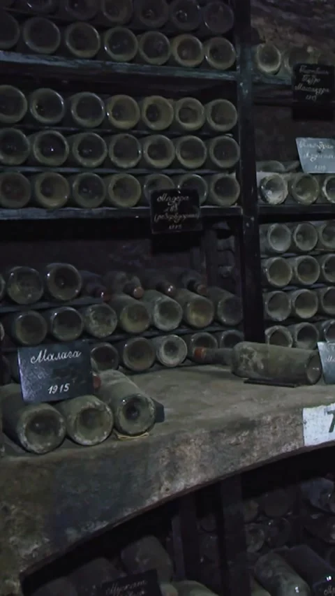 Old Aged Wine Bottles Storage in Dark Rustic Cellar Basement, Stack of Lying Dir Stock Footage 248878865