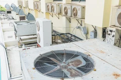 Old air conditioner compressor installed in old building Stock Photos