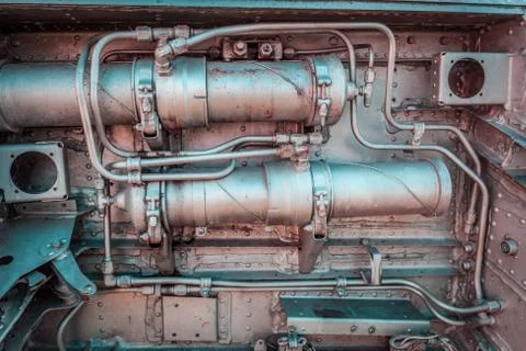 Old aircraft engine closeup with rusty decaying metal pipes and bolts Stock Photos