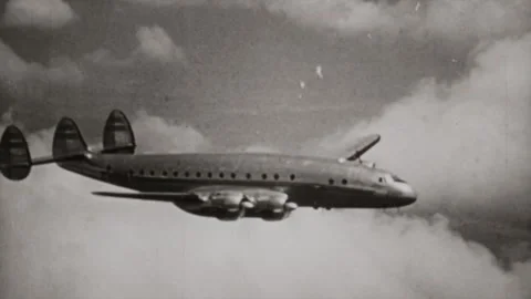 Old airliner flying between cloud vintage footage  Video stock 291931263