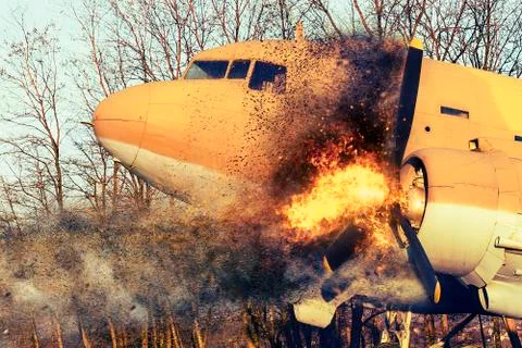 Old airplane on fire Stock Photos