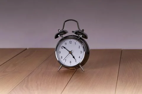 The old alarm clock on a light background 스톡 사진