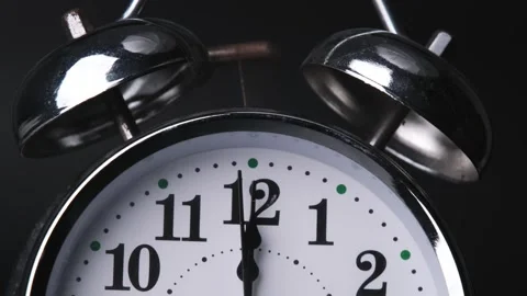 The old alarm clock was ringing at 12:00 AM or 12:00 PM.  Stock Footage 260682752