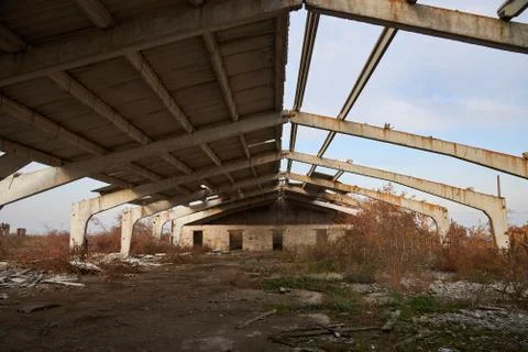 Old an almost destroyed building of cattle farm with slate roof Stock Photos