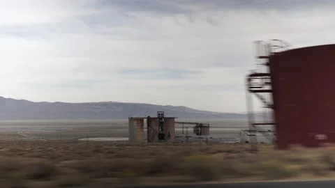 Old American Factory at Side of Road, Driving Gimbal Shot Stock Footage 145457002
