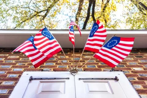 Old American flags with a ring on the building Stock Photos