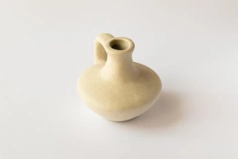 Old amphora on white Foto stock