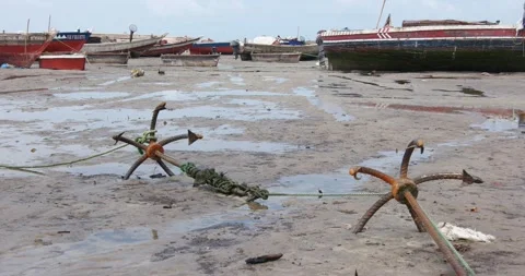 Old anchors on the beach sand Stock Footage 159355951