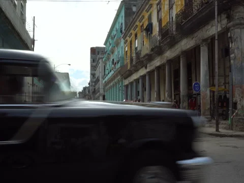 Old ancient dilapidated building with columns near the road in Havana Stock Footage 71141202