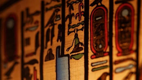 Old Ancient Egyptian Hieroglyphics Artifacts on Papyrus Lighted By Fire Stock Footage 75271618