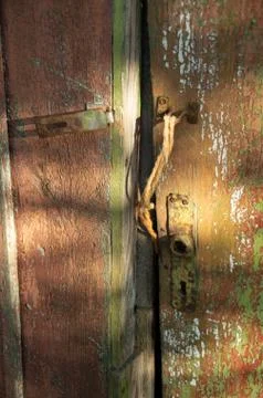 Old ancient lock on a green old door Foto stock