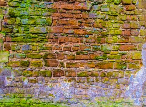 Old ancient rough cobblestone wall background texture Stock Photos