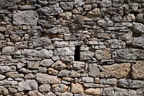Old ancient stone facade wall of medieval brick horizontal stones background Stock Photos