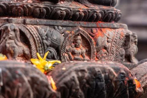Old ancient stone structures with intricate details of statue of Hindu Gods a Stock Photos