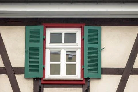 Old ancient wooden window with blind or shutters Stock Photos