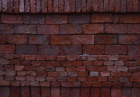 Old and aged red brick wall texture background with vignetting. Stock Photos