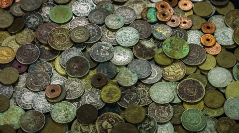Old and ancient coins covered with copper and rust close up rotation. Video stock 59778651
