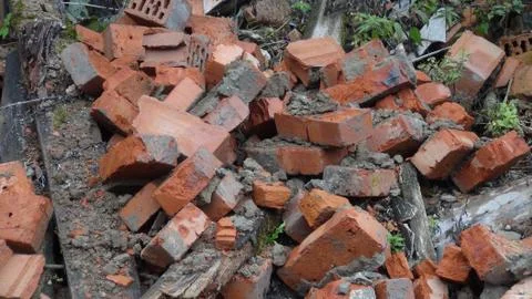 Old and broken bricks from a destroyed building in the autumn time of the yea Stock Photos
