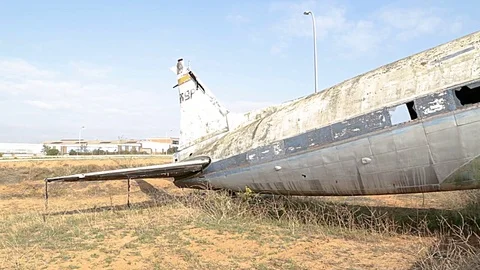 Old  and damaged spanish airplane on the disused airfield Stock Footage 81372853