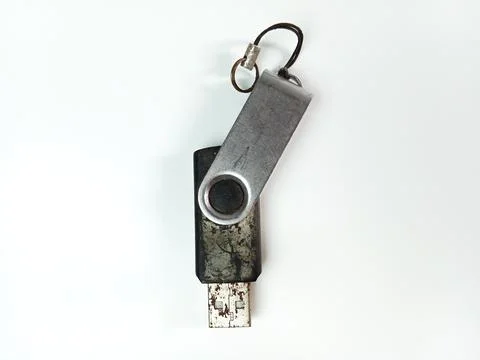 Old and damaged USB flash drive isolated on white background Stock Photos