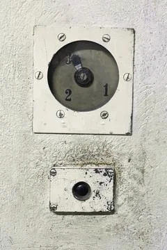 Old and dirty elevator button with a gauge Stock Photos