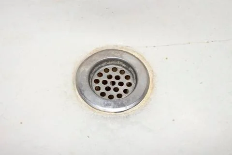 The old and the gutter in the bathroom.Rusty drain for the water. Stock Photos
