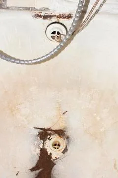 The old and the gutter in the bathroom.Rusty drain for the water. Stock Photos