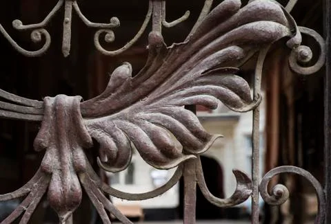 Old and modern decorative forged metal elements of fences, gates, window grating Stock Photos