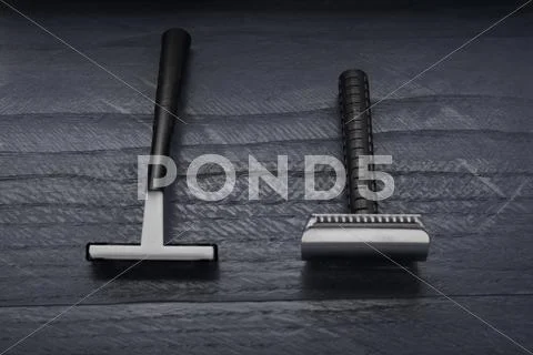 Old and new blade shaving on the dark table Stock Photos
