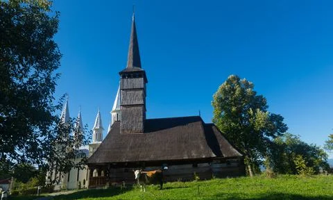 Old and new edifices of church in Remetea Chioarului, Romania Stock Photos