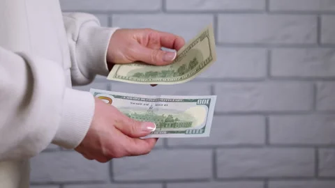 An old and a new hundred dollar bill Stock Footage 330641652