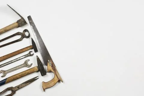 Old and rustic handy working tools on the white background Stock Photos