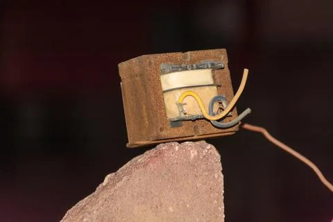 Old and rusty adaptor or electric transformer Stock Photos