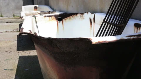 Old and rusty bathtubs Stock Footage 32326618