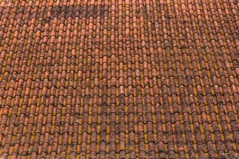 Old and rusty ceramic orange roof tiles texture Stock Photos