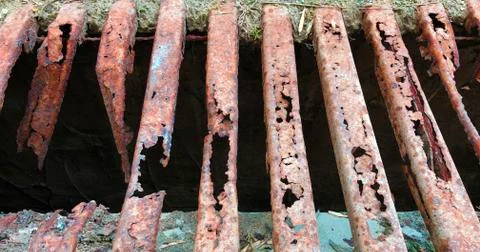 Old and rusty decayed metal street shaft grid Stock Photos
