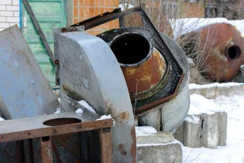 Old and rusty discarded ventilation in an abandoned and destroyed factory aga Stock Photos