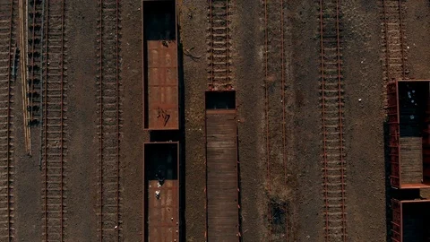 Old and rusty industrial train tracks drone shot Stock Footage 89894540