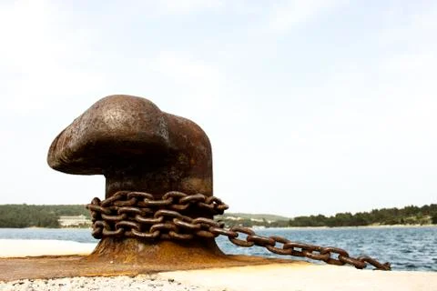 Old and rusty mooring post Stock Photos