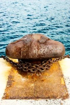 Old and rusty mooring post Stock Photos